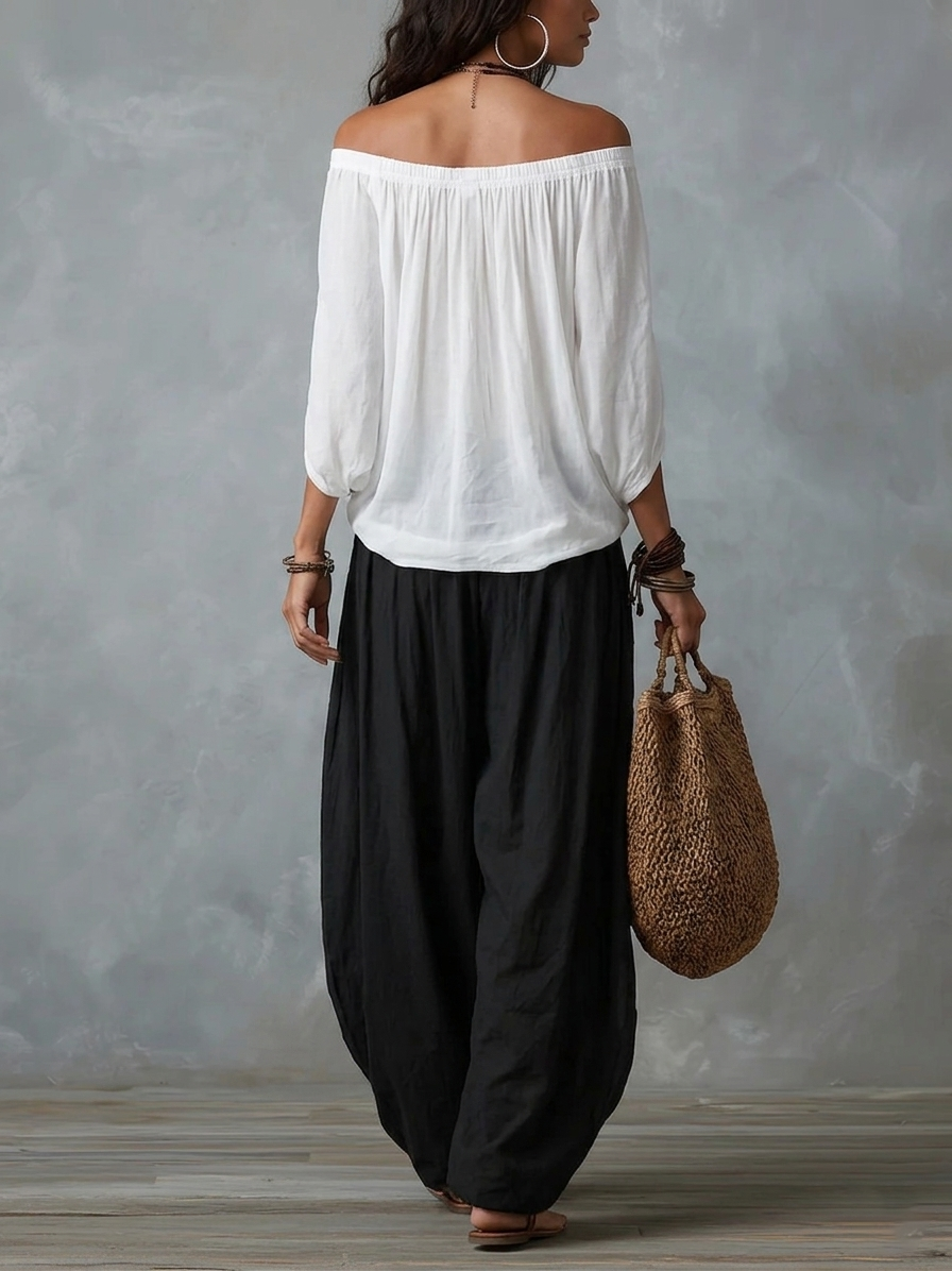Ensemble composé d'un haut blanc à épaules dénudées et d'un pantalon ample style lanterne